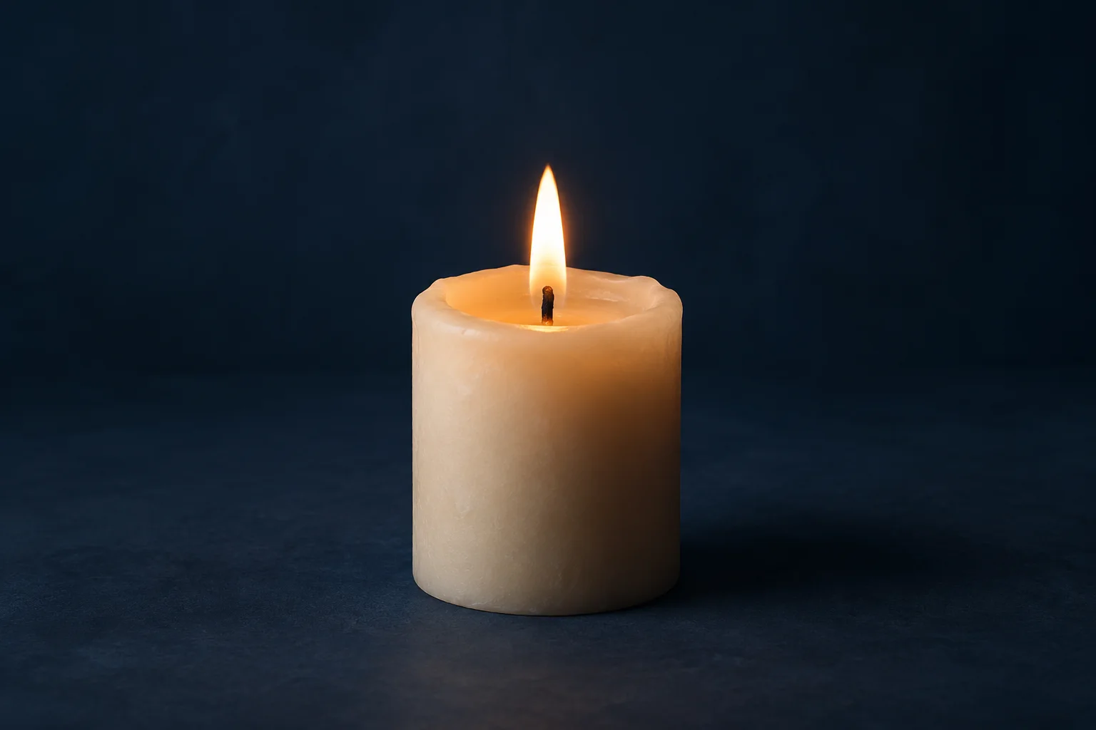Generated editorial illustration: A single simple cream wax candle with a small stable flame and shallow melted wax pool around its dark wick, matte navy background.