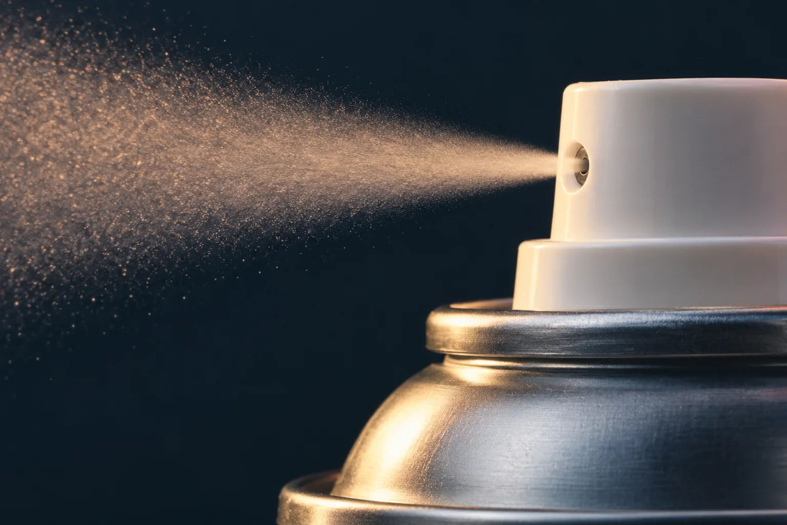 Generated editorial illustration: A white actuator on a plain metal aerosol can releasing a fine mist from its side nozzle.